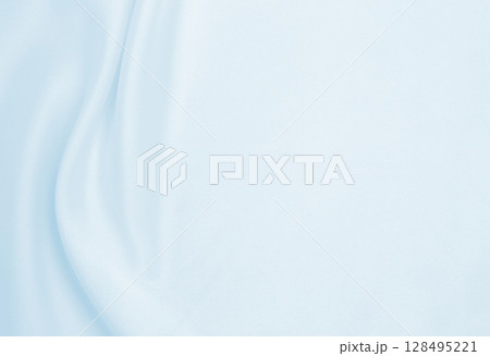 Smooth elegant blue silk or satin luxury cloth texture as abstract background. Luxurious background design Smooth elegant blue silk or satin luxury cloth texture as abstract background. Luxurious background design 128495221