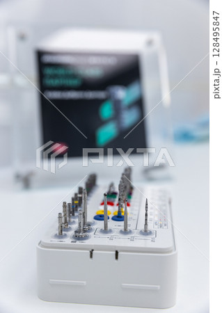 Detailed Image of a Precision Tool Set Featuring Various Attachments for Enhanced Versatility in Technical and Craft Applications 128495847