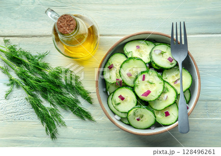 Cucumber salad with olive oil, dill and red onion, shot from the top Cucumber salad with olive oil, dill and red onion, shot from the top 128496261
