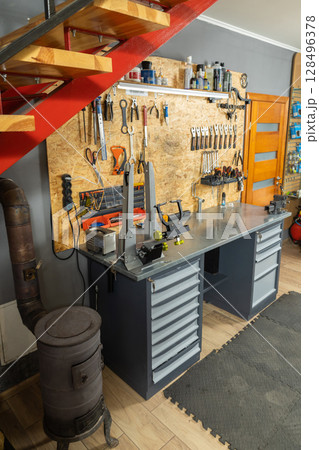 Mechanic workshop contains professional tools for bicycle repair Mechanic workshop contains professional tools for bicycle repair 128496378