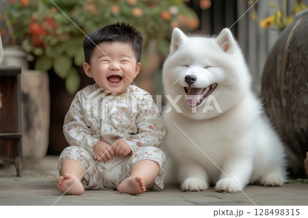 Joyful connection between a baby boy and a playful white sand dog in a sunny moment 128498315