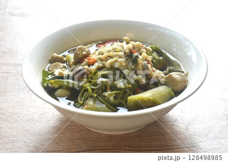 sweet Melientha suavis and mixed vegetable with red ant egg in fermenting fish sauce curry soup on bowl 128498985