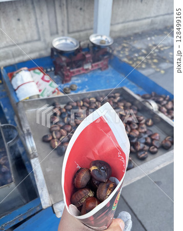roasted chestnuts on a street stall. High quality photo 128499165