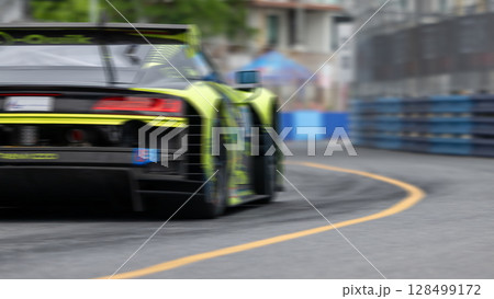 Motion blur race car racing on speed track, Motion blurred super car race on street track circuit, Automobile automotive transportation vehicle background, 128499172