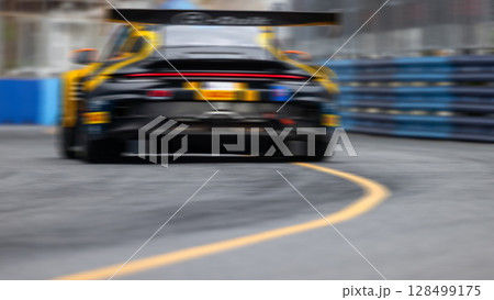Motion blur race car racing on speed track, Motion blurred super car race on street track circuit, Automobile automotive transportation vehicle background, 128499175