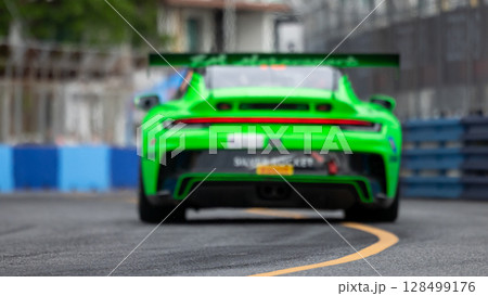 Motion blur race car racing on speed track, Motion blurred super car race on street track circuit, Automobile automotive transportation vehicle background, 128499176