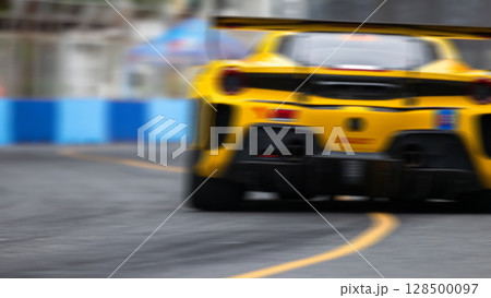 Motion blur race car racing on speed track, Motion blurred super car race on street track circuit, Automobile automotive transportation vehicle background, 128500097