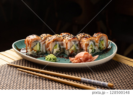 Sushi rolls with salmon, avocado 128500148
