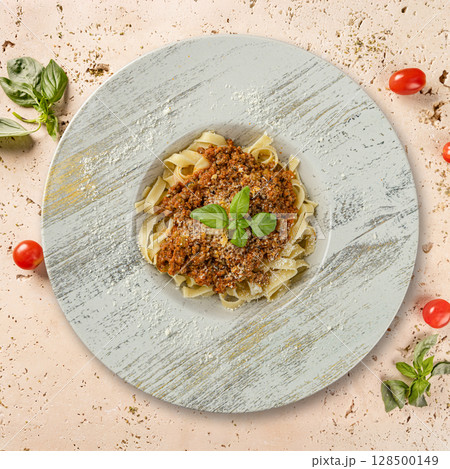 Tasty tagliatelle pasta with bolognese sauce Tasty tagliatelle pasta with bolognese sauce 128500149