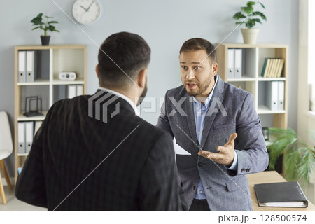 Angry business people colleagues disputing having disagreement fighting at workplace Angry business people colleagues disputing having disagreement fighting at workplace 128500574