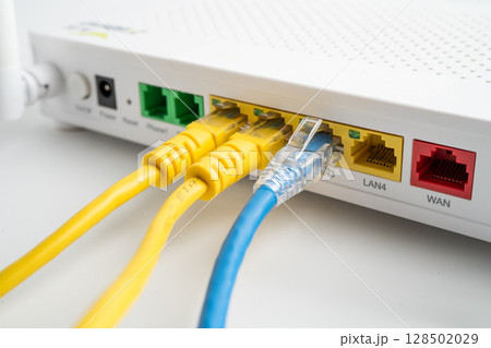 Ethernet cable with wireless router connect to internet service provider internet network. 128502029