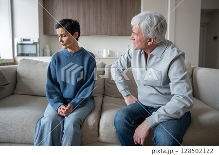 Elderly couple in conflict, husband blaming woman while frail wife fear speaking due to abusive Elderly couple in conflict, husband blaming woman while frail wife fear speaking due to abusive 128502122