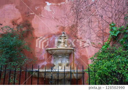 Historic Fountain in Santa Cruz Quarter, Seville, Andalusia, Spain. Historic Fountain in Santa Cruz Quarter, Seville, Andalusia, Spain. 128502990