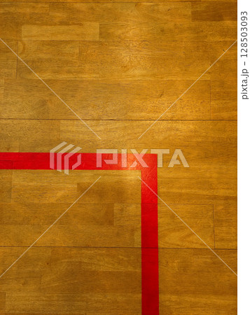 Red boundary line on wooden floor in sports hall squash, copy space 128503093