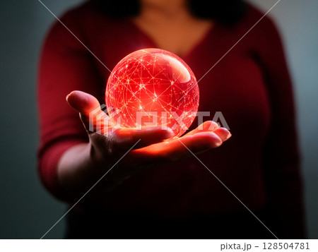 手のひらに浮かぶ抽象的な赤色の球体 128504781