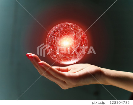 手のひらに浮かぶ抽象的な赤色の球体 128504783