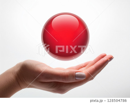手のひらに浮かぶ抽象的な赤色の球体 128504786