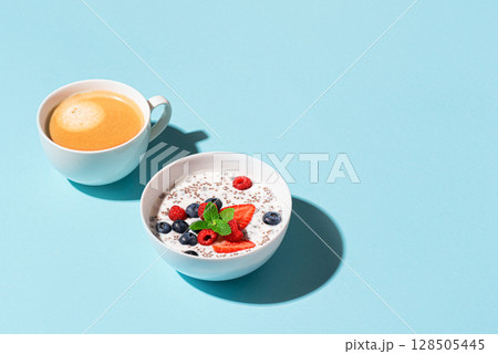 Healthy breakfast with chia bowl and cappuccino coffee Healthy breakfast with chia bowl and cappuccino coffee 128505445