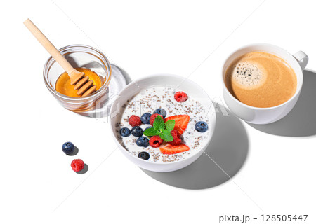 Chia bowl with berries and coffee for breakfast 128505447