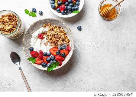 Granola bowl with greek yogurt and fresh berries Granola bowl with greek yogurt and fresh berries 128505484