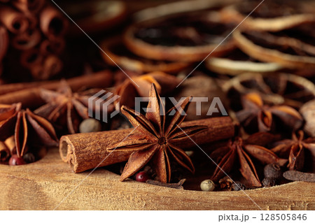 Various Christmas spices with dried citrus slices. Various Christmas spices with dried citrus slices. 128505846