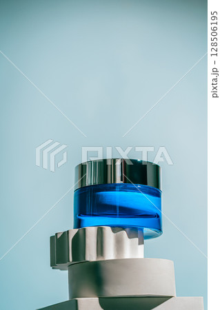 A blue glass jar of revitalizing face night cream A blue glass jar of revitalizing face night cream 128506195
