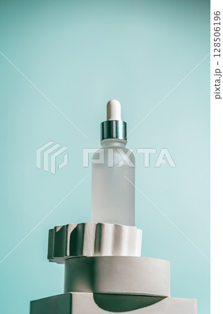 A frosted dropper bottle of facial serum 128506196