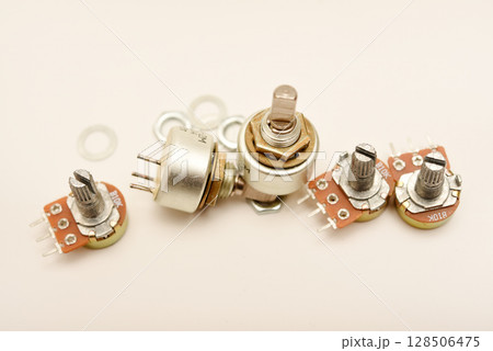 Potentiometers. Variable resistors. Devices for voltage changes. 128506475