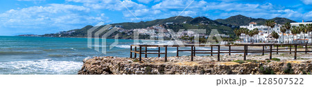 Wonderful landscapes of the shimmering sea and charming city unfold, offering breathtaking coastal views and a picturesque atmosphere in Nerja, Spain 128507522