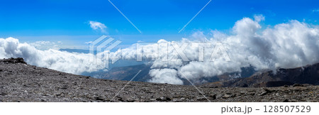 Cloudy over mountains on hiking trail to Mulhacen peak, Sierra Nevada National park, Andalusia, Spain 128507529