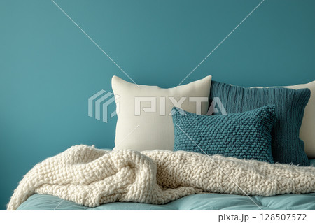 bedroom interior with plush pillows, soft blanket draping comfortably over bed, against calming wall World Sleep Day bedroom interior with plush pillows, soft blanket draping comfortably over bed, against calming wall World Sleep Day 128507572