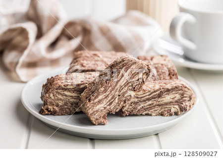 Halva with cocoa. Sweet oriental dessert on plate. Halva with cocoa. Sweet oriental dessert on plate. 128509027