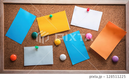 Colorful corkboard with notes and pins, symbolizing creativity and organization Colorful corkboard with notes and pins, symbolizing creativity and organization 128511225