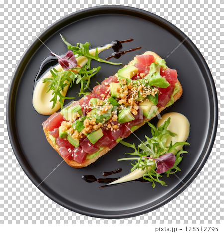 Bluefin tuna tartare with avocado mousse on toasted bread garnished with microgreens and sesame seeds on black plate 128512795