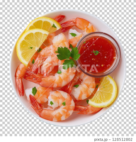 Chilled Prawn Cocktail Served with Tangy Sauce and Fresh Lemon Garnish on a White Plate 128512802