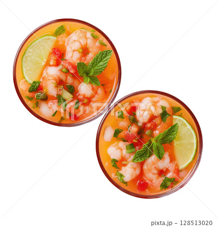 Delicious Chilled Prawn Cocktail served with Fresh Lime and Aromatic Herbs in Elegant Glass Bowls 128513020