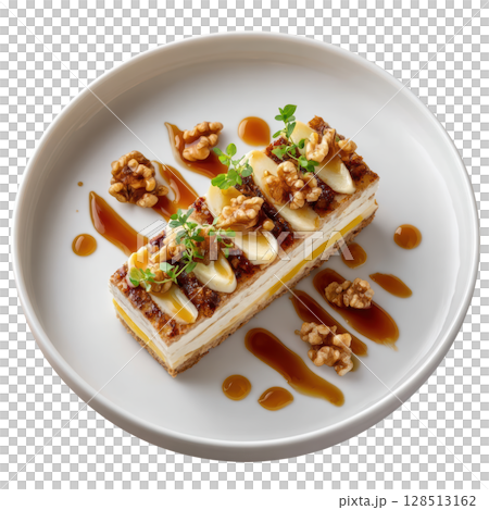 Roasted Jerusalem Artichoke Terrine Layered with Smoked Cheddar and Caramelized Pear on a Plate with Walnut Jus 128513162