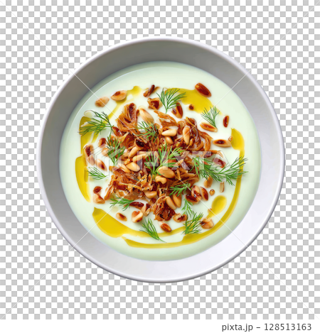 Creamy Pale Green Fennel Veloute Soup with Crispy Toppings and Drizzle of Anise Oil in a Shallow Bowl 128513163