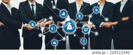 Business professionals collaborating with technology icons representing reduction, efficiency, and service improvement in a corporate environment. Amity Business professionals collaborating with technology icons representing reduction, efficiency, and service improvement in a corporate environment. Amity 128513340