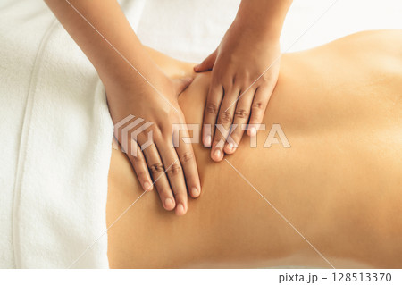 Closeup woman customer enjoying relaxing anti-stress massage. Quiescent 128513370