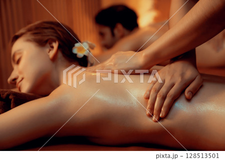Caucasian couple customer enjoying relaxing anti-stress massage. Quiescent Caucasian couple customer enjoying relaxing anti-stress massage. Quiescent 128513501