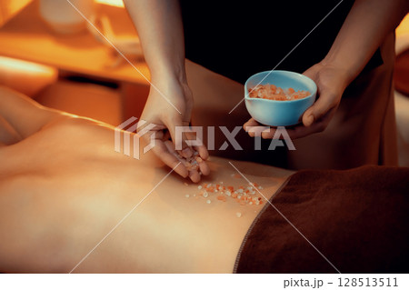 Woman customer having exfoliation treatment in luxury spa. Quiescent Woman customer having exfoliation treatment in luxury spa. Quiescent 128513511