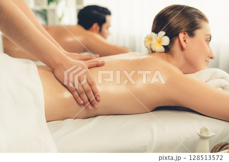 Caucasian couple customer enjoying relaxing anti-stress massage. Quiescent 128513572