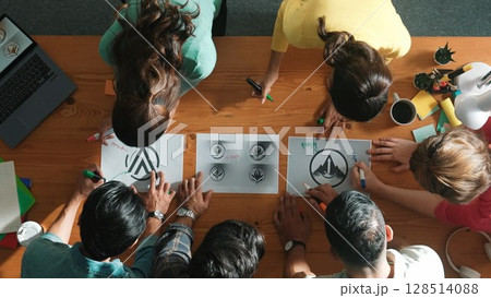Top view of smart business team put graphic logo on meeting table. Symposium. Top view of smart business team put graphic logo on meeting table. Symposium. 128514088