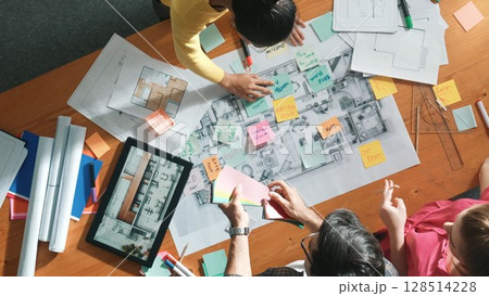 Time lapse of skilled engineer working together to design building. Symposium. Time lapse of skilled engineer working together to design building. Symposium. 128514228