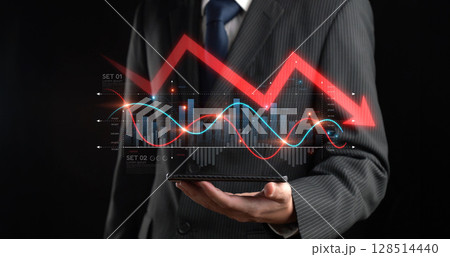 Businessman Holding Tablet with Decreasing Stock Market Charts and Economic Crisis Concept in Dark Background XDMCP Businessman Holding Tablet with Decreasing Stock Market Charts and Economic Crisis Concept in Dark Background XDMCP 128514440