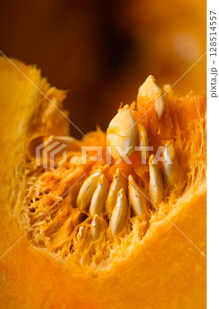 Juicy slice of orange pumpkin with bright orange flesh 128514557
