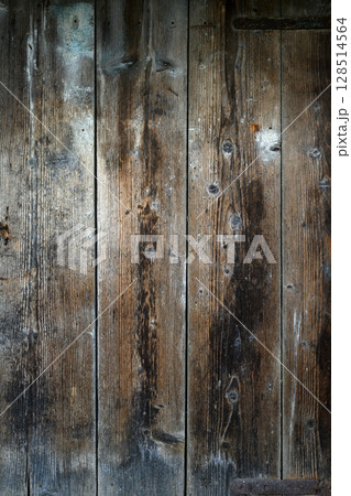 Old wooden barn door on a village courtyard 128514564
