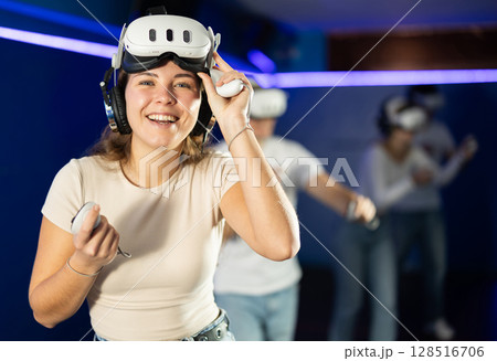 Stunned by exciting game, girl lowered helmet and took break from game. Stunned by exciting game, girl lowered helmet and took break from game. 128516706