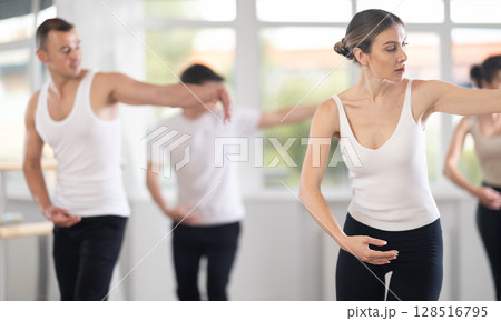 Group of dancers rehearsing ballet dance Group of dancers rehearsing ballet dance 128516795
